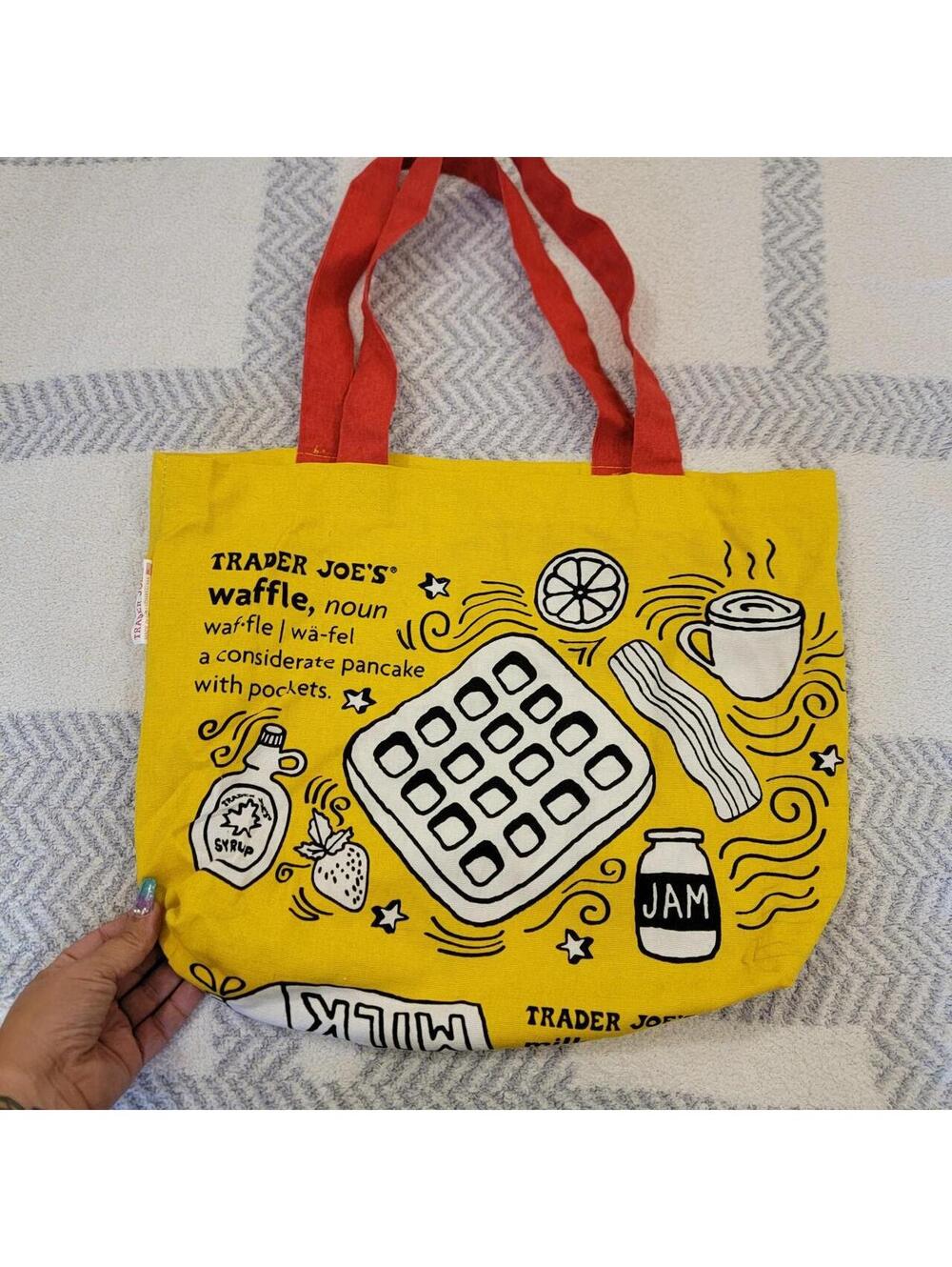 Trader Joe's yellow tote bag with white line drawings of waffles, bacon, coffee